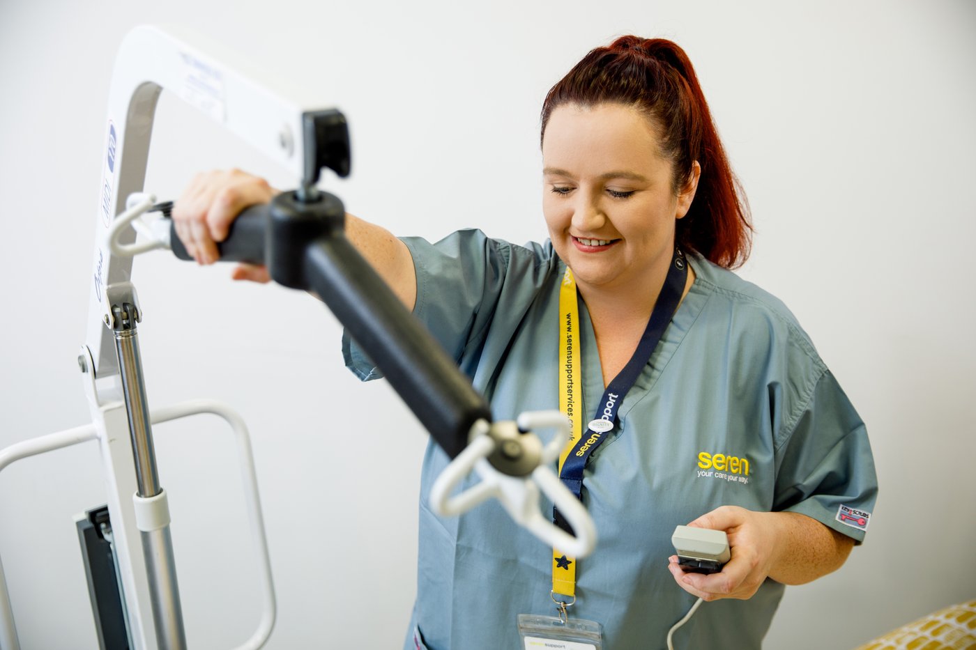 Seren care professional using a hoist for safe care delivery
